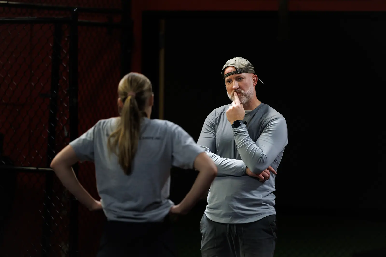 Coach Aaron listening to an athlete during an assessment