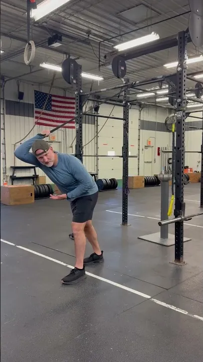 Coach Aaron demonstrating a three-way shoulder band routine